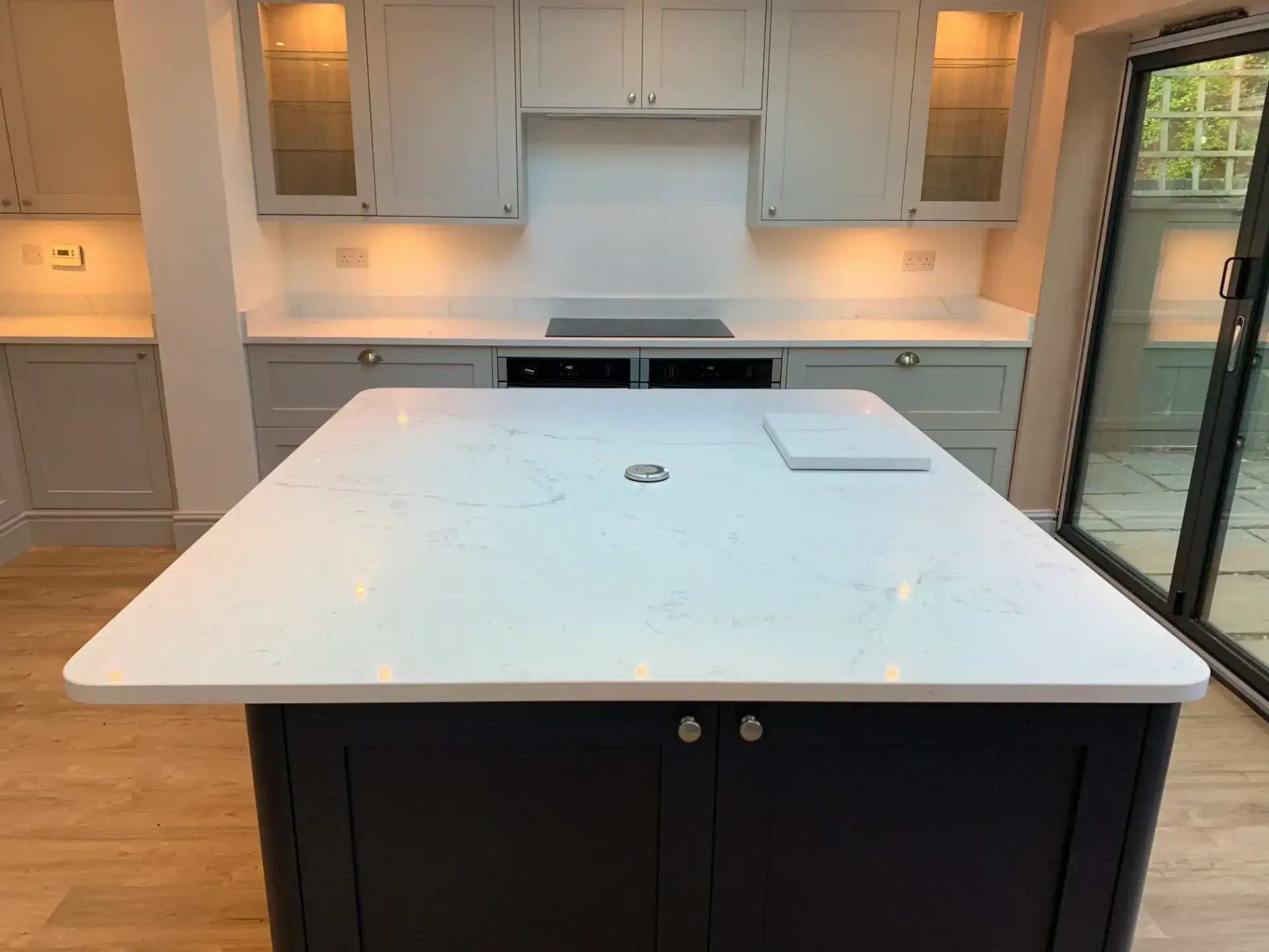 Modern Kitchen With White Marble Island.