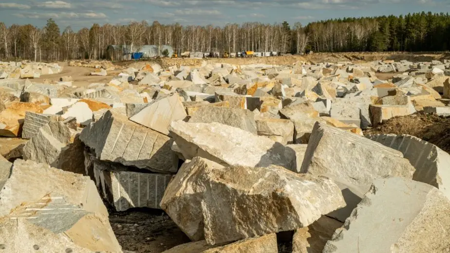 Huge Stones Or Pieces Of Rocks At Quarry Or Construction Site In Natural Environment